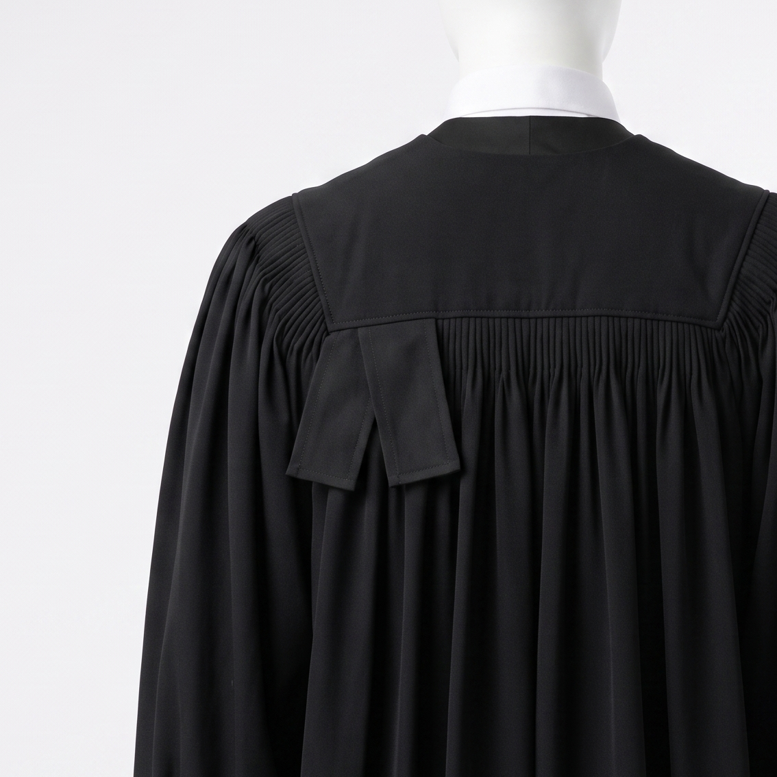 Pleated bow and yoke at the back of the barrister gown